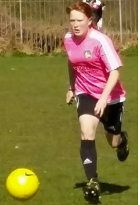 Megan playing football for her team